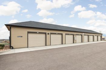 a row of garage doors on the side of a building
