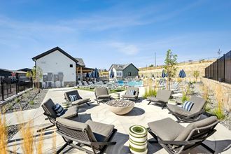 the preserve at ballantyne commons pool and patio area with lounge chairs and tables
