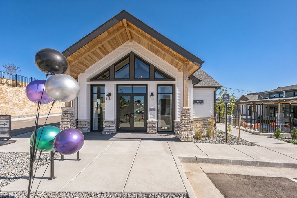 the front of our building with balloons on the sidewalk at Citadel at Castle Pines, Castle Pines, CO, Colorado