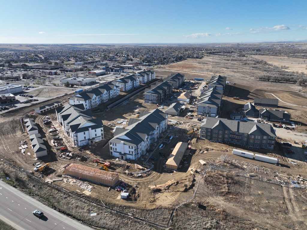 an aerial view of a development of houses in a city
