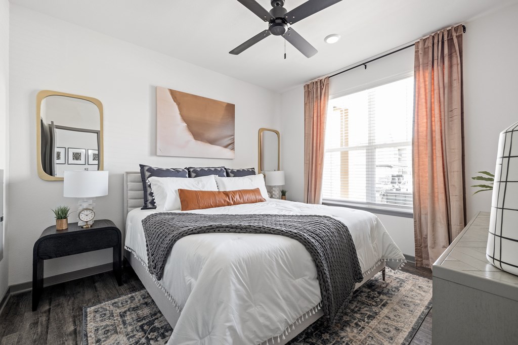 a bedroom a bedroom with a bed and a ceiling fan at Notch66, Longmont, Colorado