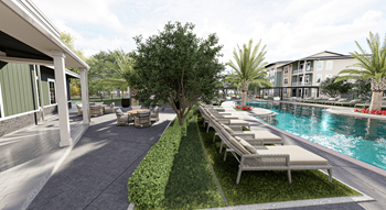 A poolside area with lounge chairs and a tree in the middle at Verity Luxury Apartment Homes Apartments, Vero Beach, Florida