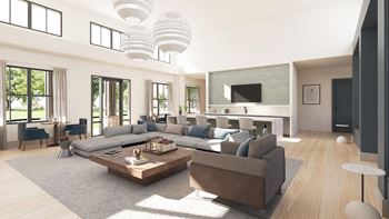 a large living room with a large couch and a table