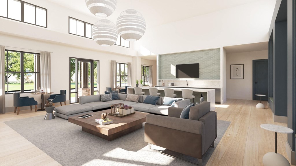 a large living room with a large couch and a table