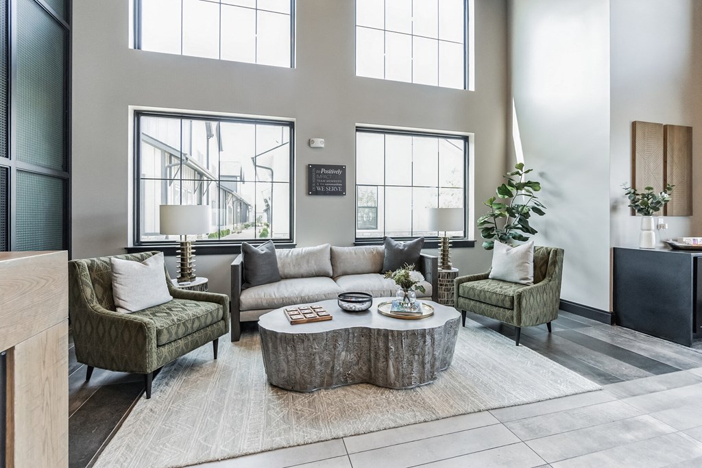 a living room with high ceilings and large windows at Slate at Fishers District, Fishers, 46037