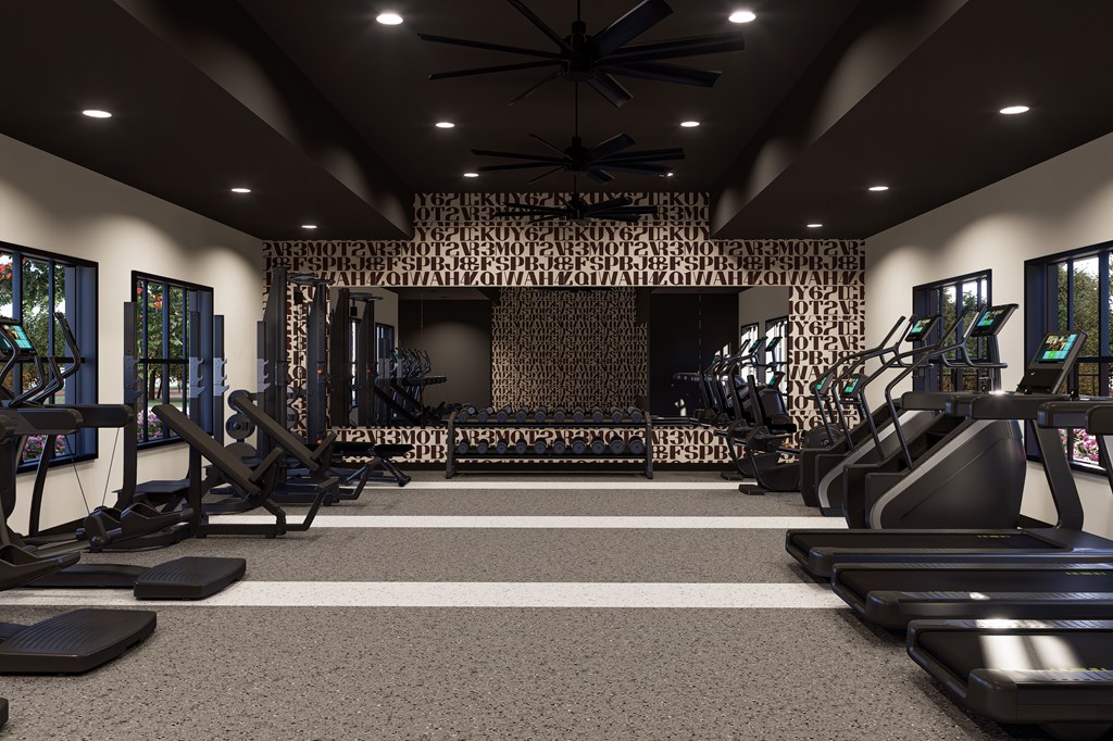 A gym with treadmills, elliptical machines, and a wall of windows. A gym with treadmills, elliptical machines, and a wall of windows at The Logan Luxury Apartments, Nampa, Idaho