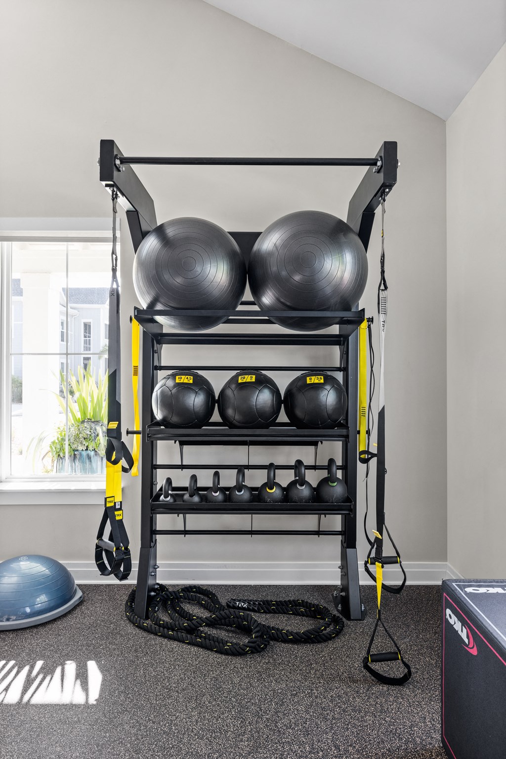 a fitness room with a rack of weights and cardio equipment at Palm Grove in Ellenton, FL 34222