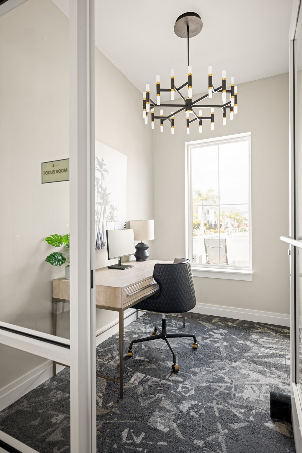 a home office with a desk and chair and a window at Palm Grove in Ellenton, FL 34222