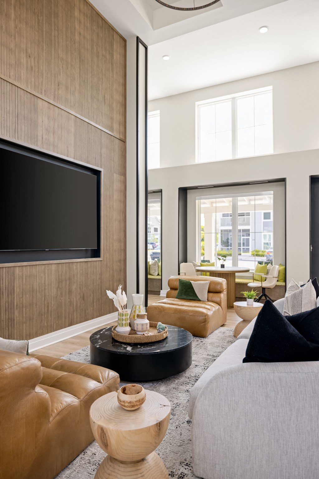 a living room with couches and chairs and a tv at Palm Grove in Ellenton, FL 34222