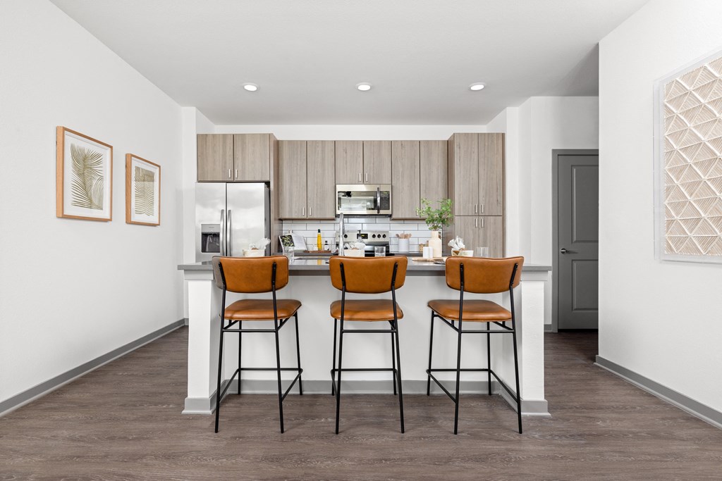 a kitchen with a bar at Palm Grove in Ellenton, FL 34222