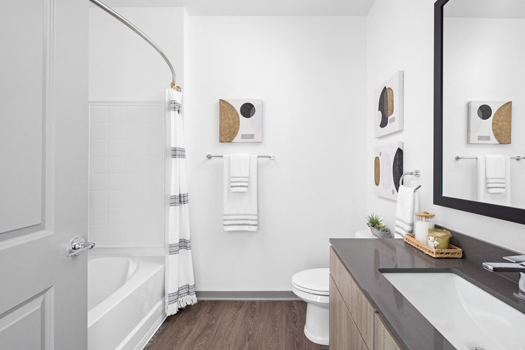 a bathroom with a shower and a sink and a toilet at Palm Grove in Ellenton, FL 34222