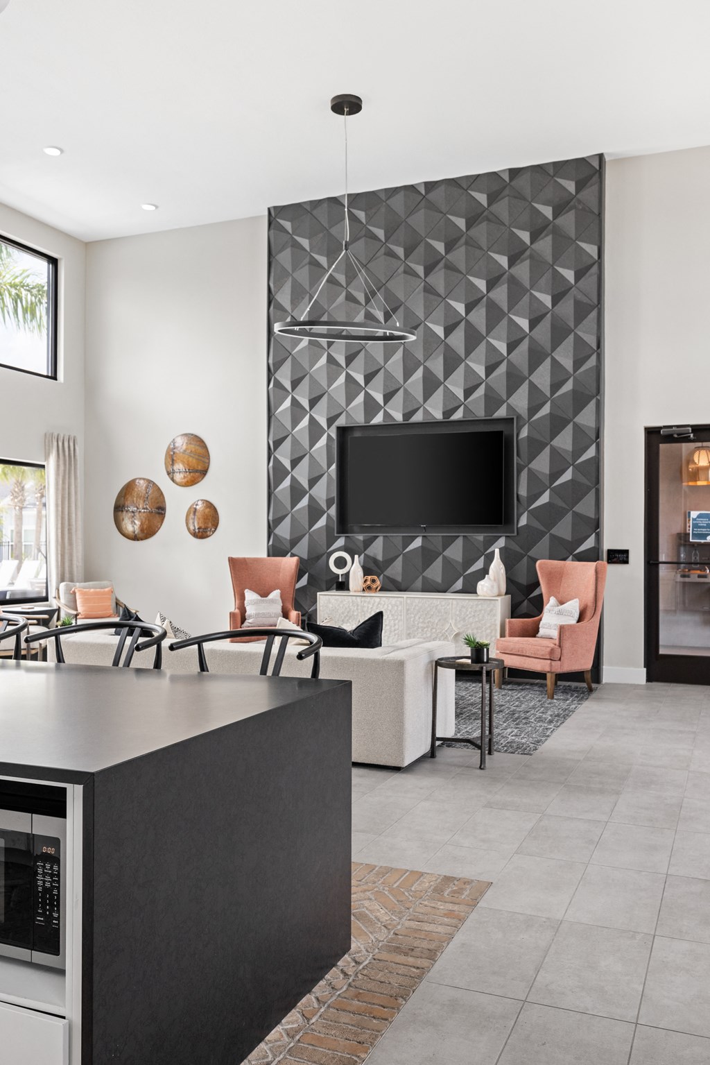 a living room with a tv and a table and chairs at The Sophia, Venice, FL, 34275