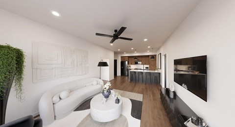 A modern living room with a white sofa and a coffee table.