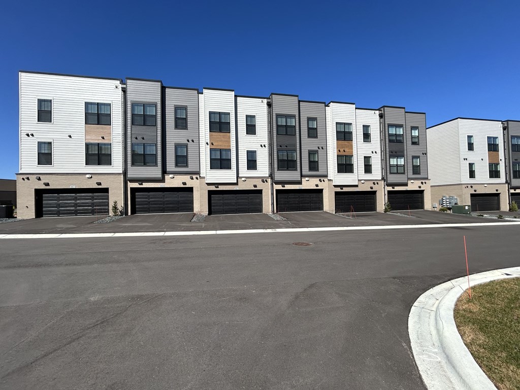 an apartment building with a street in front of it at Meridian at CityPlace, Woodbury