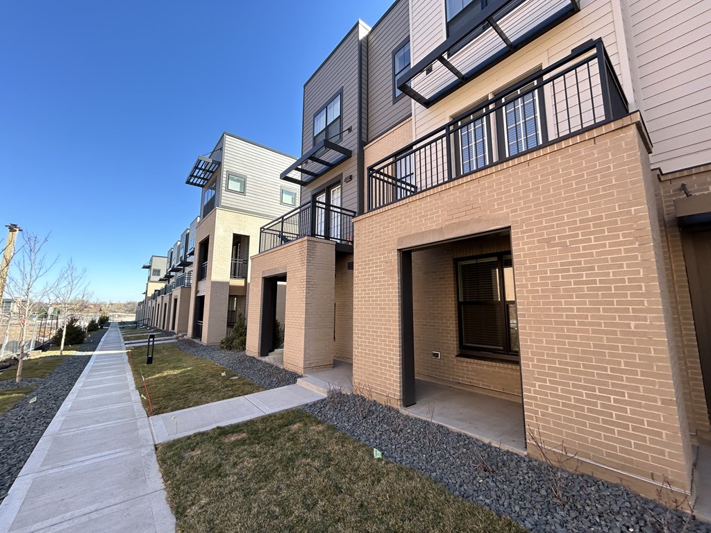 a view of a building with a sidewalk in front of it at Meridian at CityPlace, Minnesota, 55125