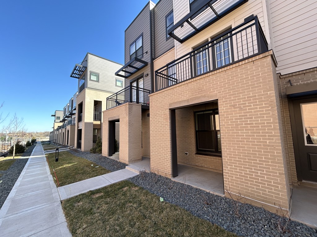 a view of a building with a sidewalk in front of it at Meridian at CityPlace, Woodbury