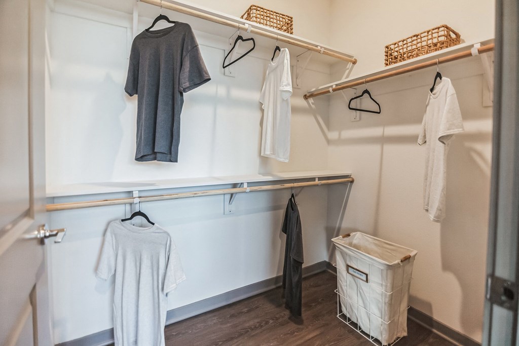 a walk in closet with white walls and wooden floors  at Palm Grove, Ellenton