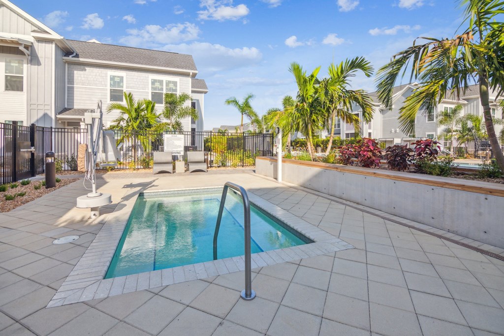 a small swimming pool in a patio with a house  at Palm Grove, Ellenton, FL, 34222