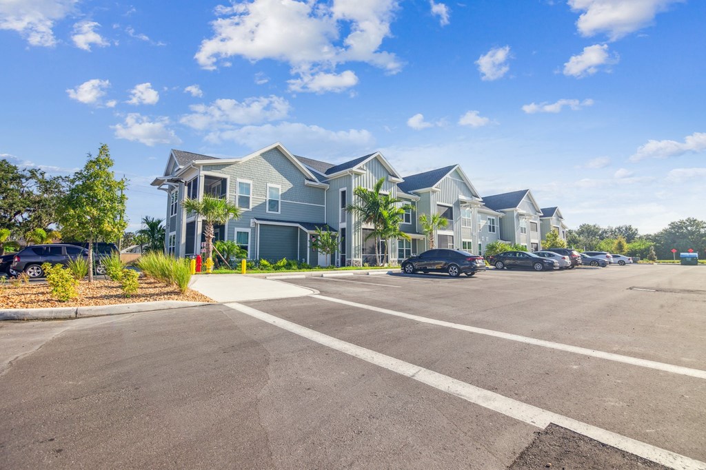 an empty parking lot in front of a row of houses  at Palm Grove, Florida, 34222