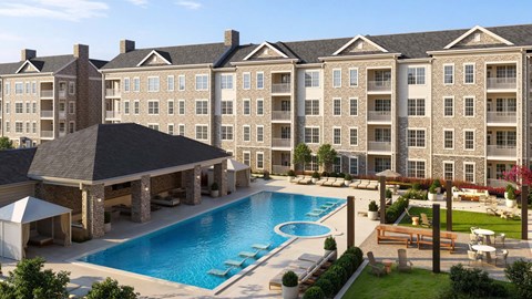 A large building with a pool in front.