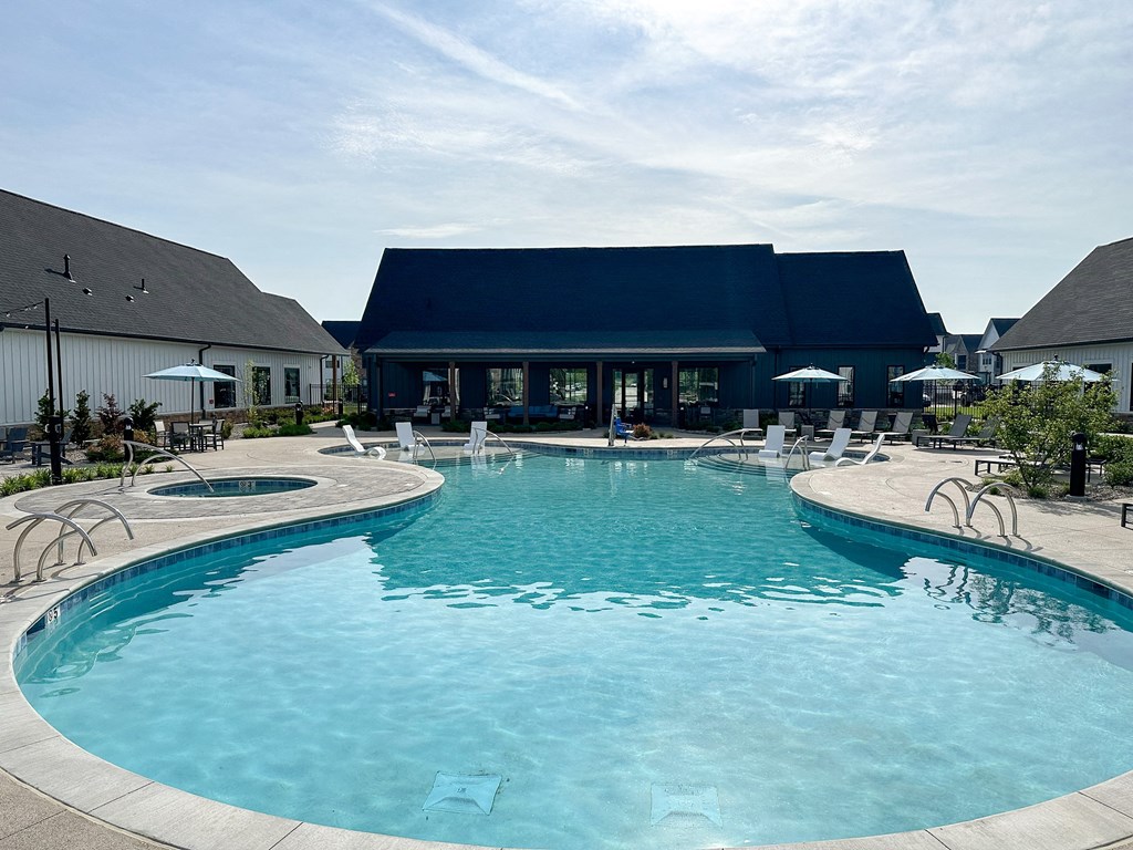 a large swimming pool with a building in the background at The BLVD at Wilson Crossings, Michigan, 49418