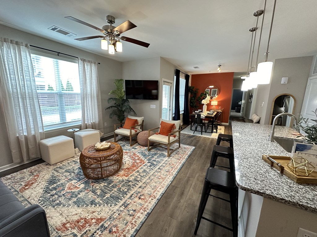 the view of the living room from the kitchen at Watermark at Steele Crossing, Fayetteville