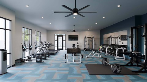 Spacious fitness center with cardio equipment and weight training area at The Maverick Luxury Apartments, Monument, Colorado
