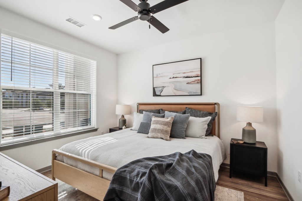 a bedroom with a bed and a ceiling fan a bedroom with a bed and a ceiling fan at Stella, Arizona, 85143