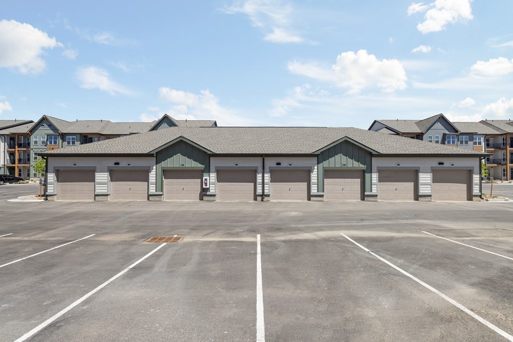 an empty parking lot in front of a building