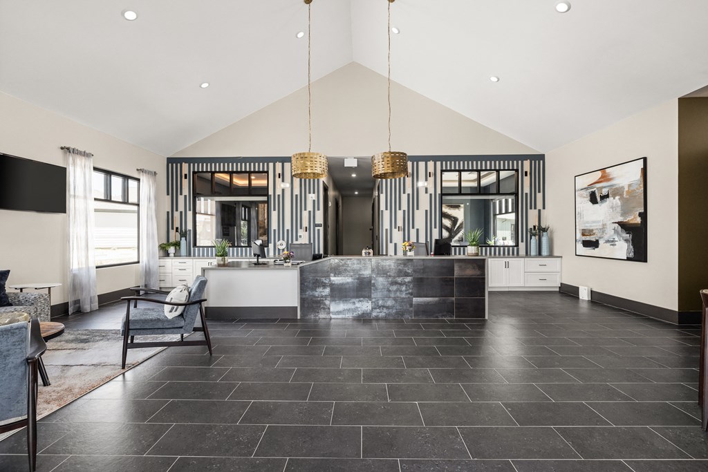 the kitchen and living area of a house with black and white stripes on the wall