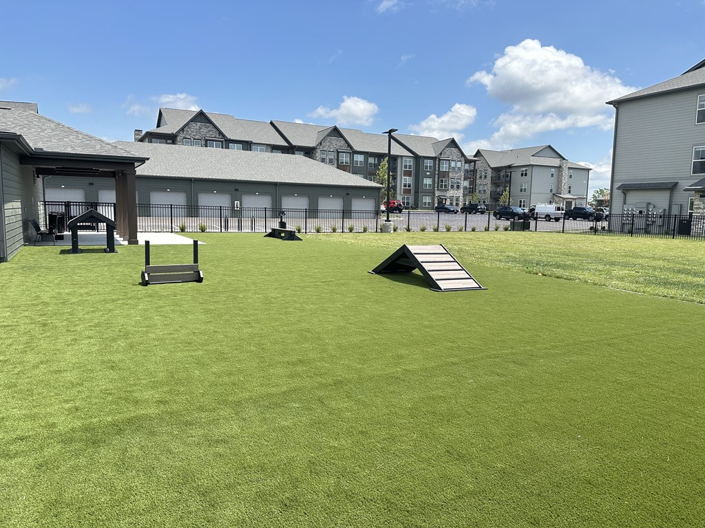 a simulator in the middle of a lawn in front of a building