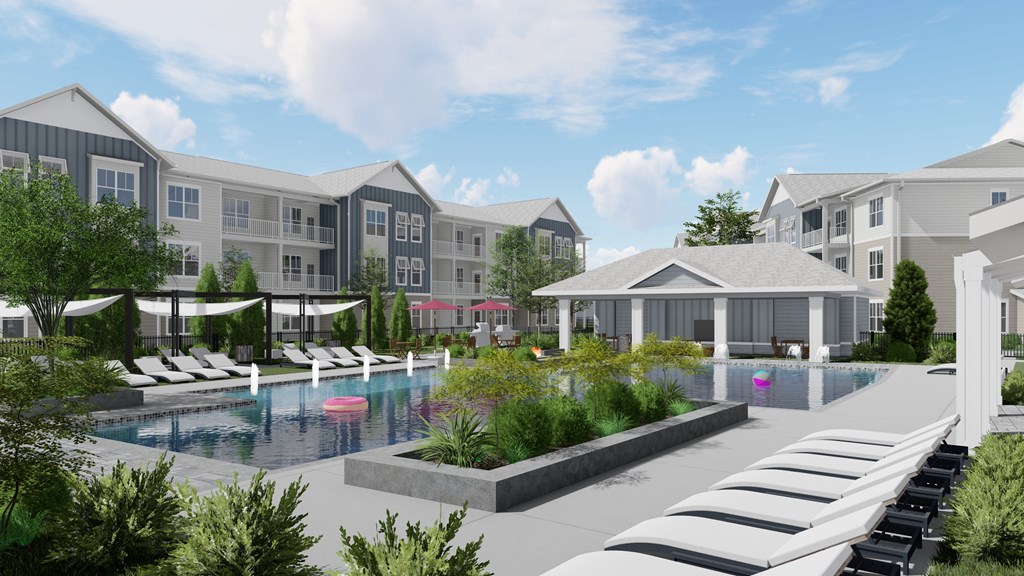 A modern building complex with a pool and a parking lot.