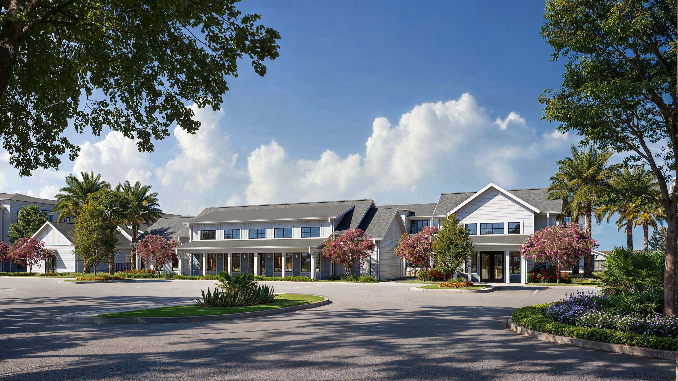 A large building with a driveway in front of it.