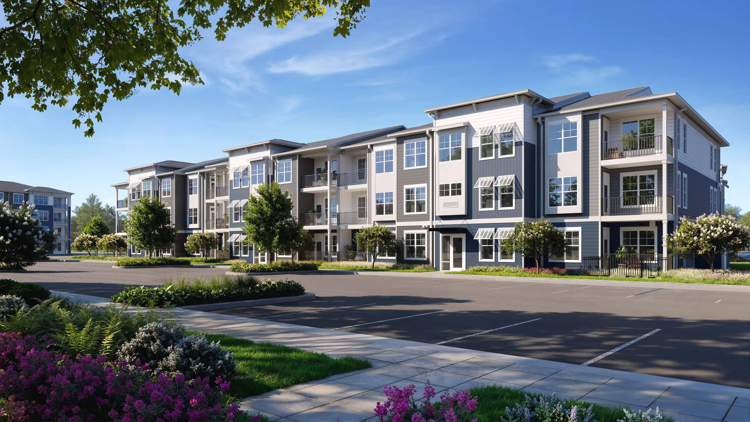 A row of modern townhouses with a well-maintained front yard.