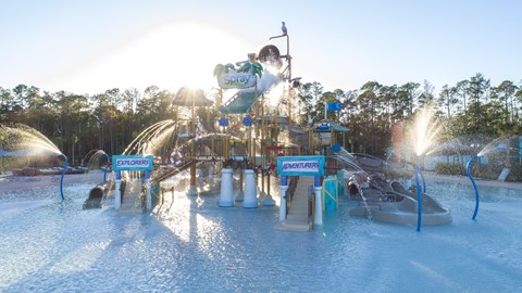 A water park with a large water slide and a person on it at Velara Luxury Apartments, Florida, 32081