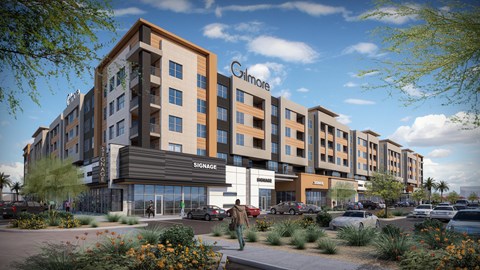 A modern apartment complex with the name Gilmore at The Residences at The Gilmore in Gilbert, AZ