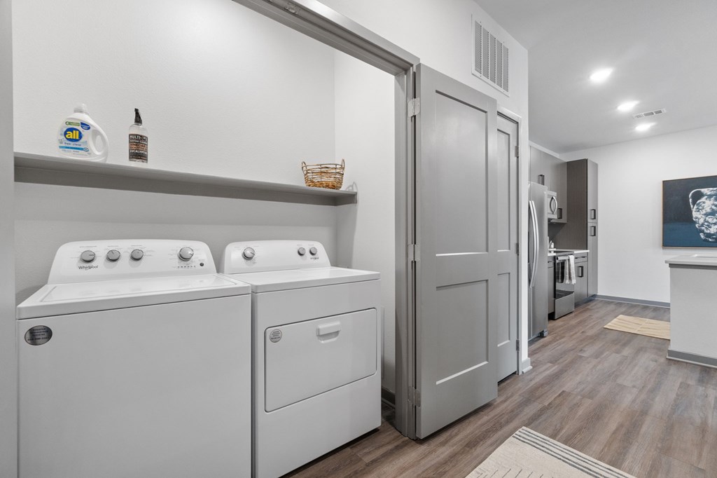 A laundry room with a washer and dryer.