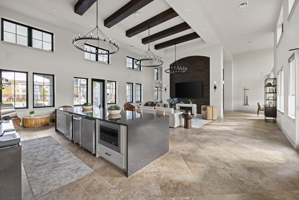 A modern kitchen with a large island and a fireplace.