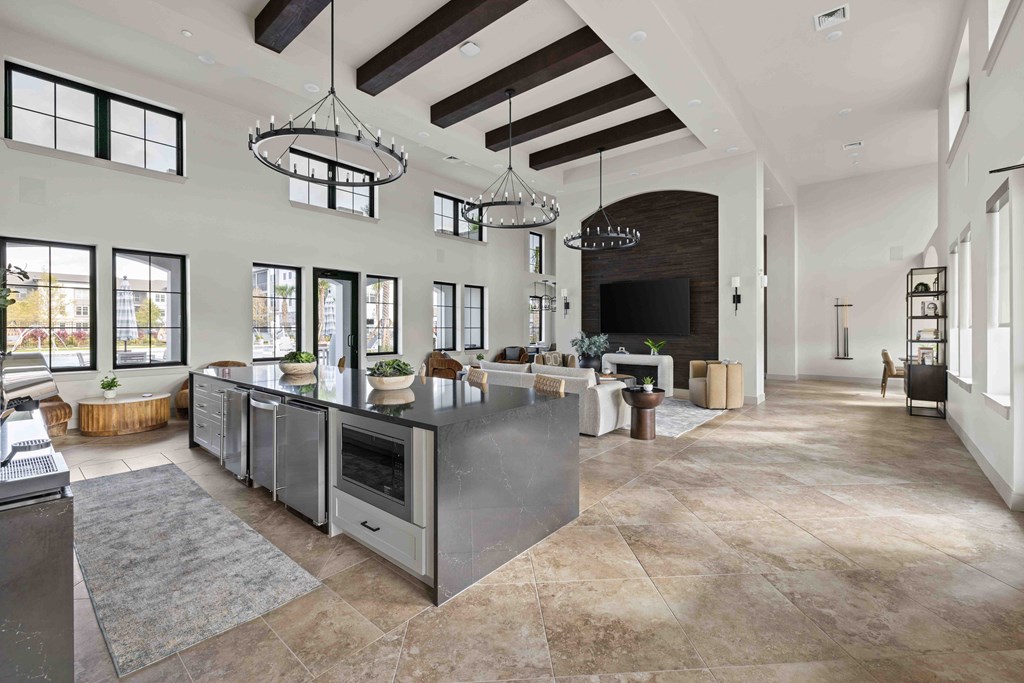 A modern kitchen with a large island and a fireplace.