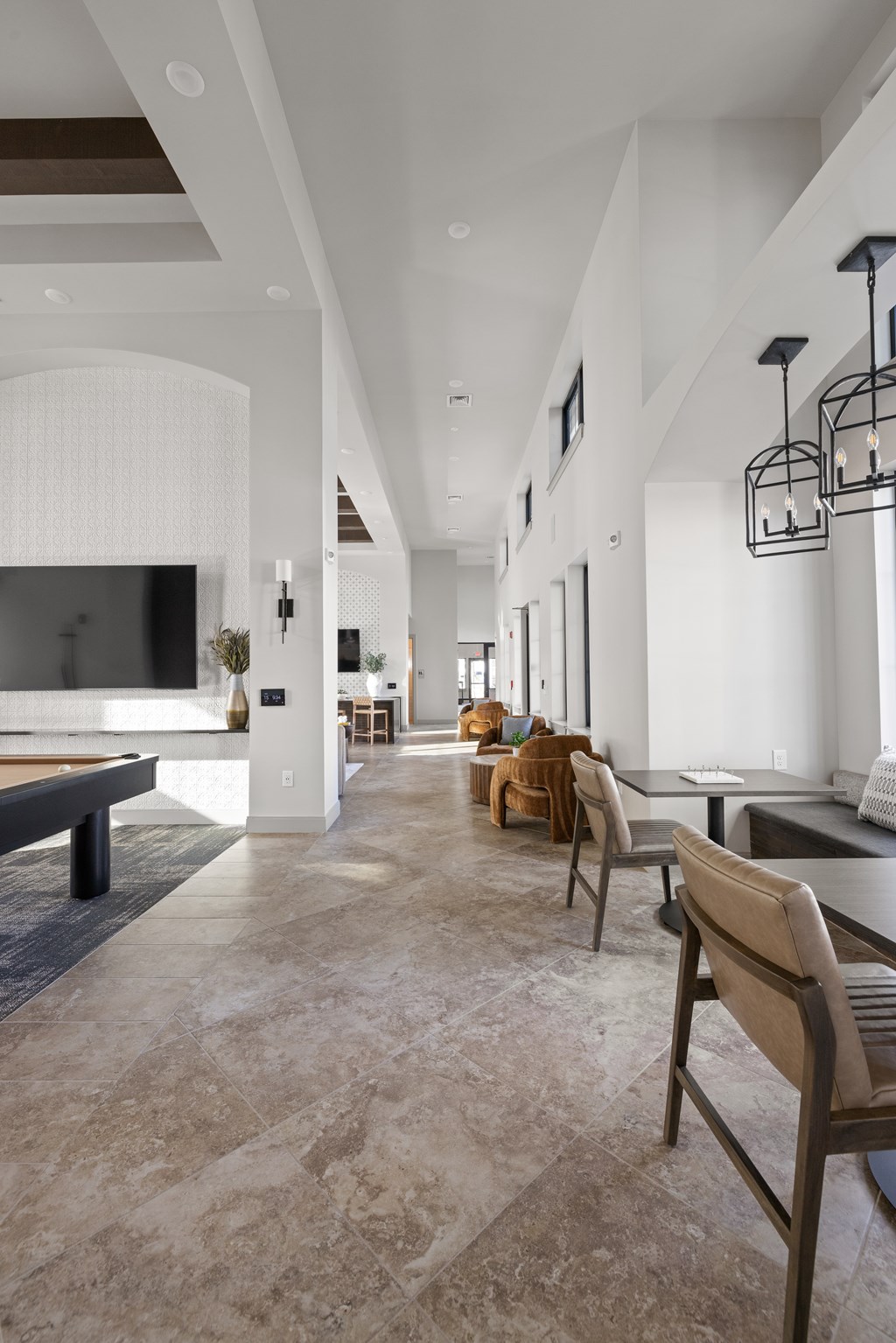 A modern living room with a long hallway and a bench.
