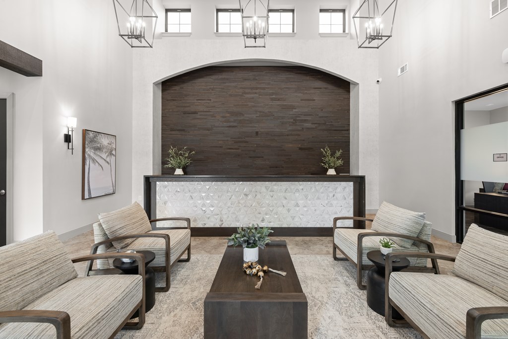 A modern living room with a dark wood arched doorway and a white marble bench.