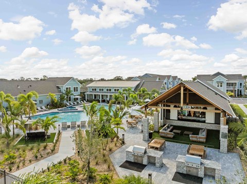 A large house with a pool and a patio area.