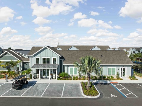 A building with a parking lot in front of it.