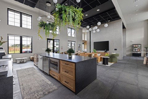 A modern kitchen with a large island and lots of counter space.