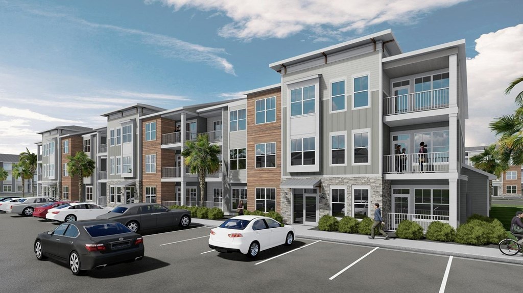 a rendering of an apartment building with cars in a parking lot  at The Quinn, Pensacola, FL