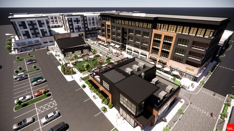 A rendering of a modern building complex with a parking lot in front at The Union Flats at Fishers District, Fishers