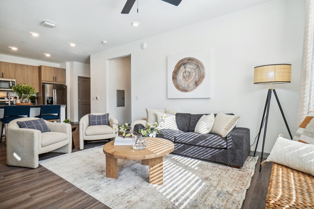 a living room with a couch and a coffee table at Premier at West Park Luxury Apartment Homes, Greeley, 80634