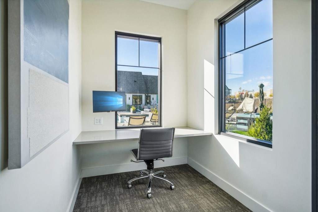 a home office with a desk and a chair and a window at Premier at West Park Luxury Apartment Homes, Colorado