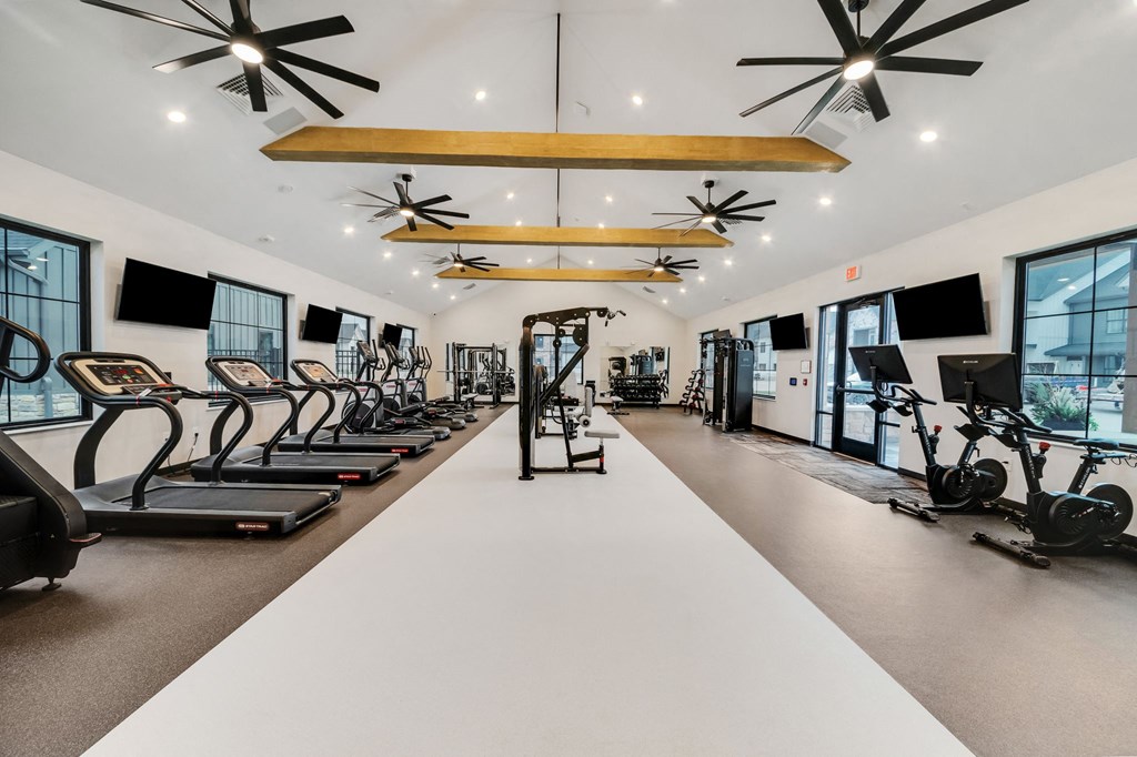 the gym with treadmills and other exercise equipment at the flats at west end at The BLVD at Wilson Crossings, Wyoming