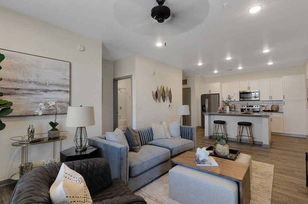 a living room with couches and a coffee table  at Upland Flats, Colorado Springs, CO
